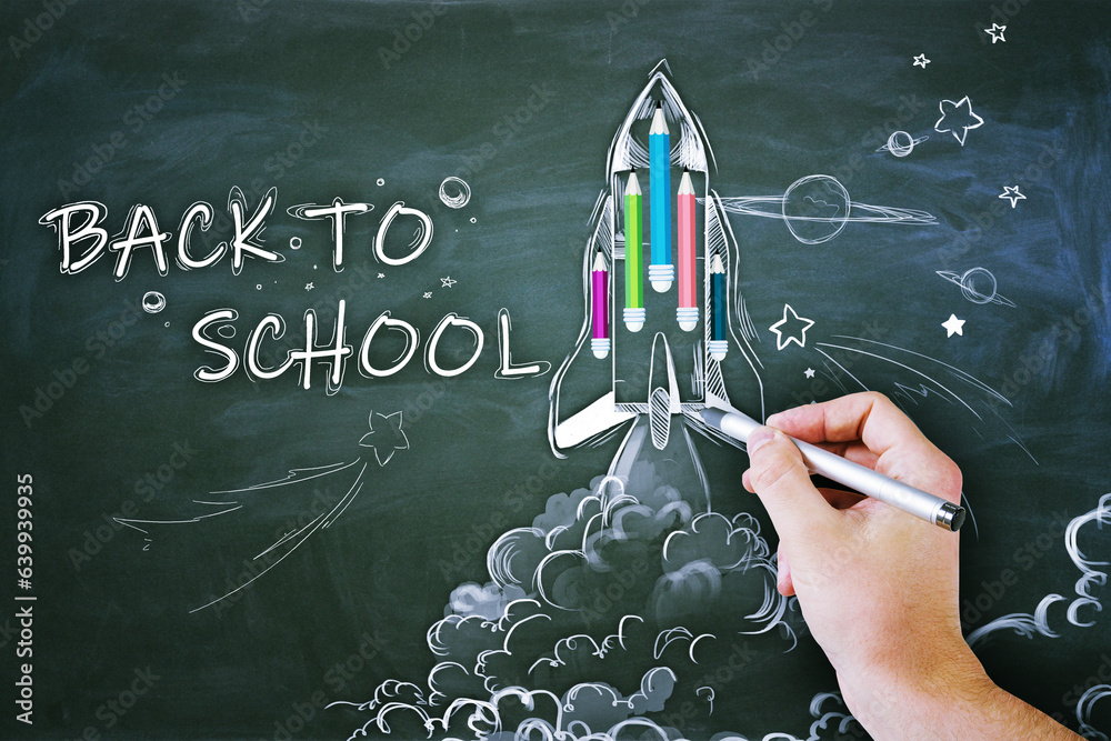 Poster close up of male hand drawing abstract back to school sketch with pencils and rocket on chalkboard w