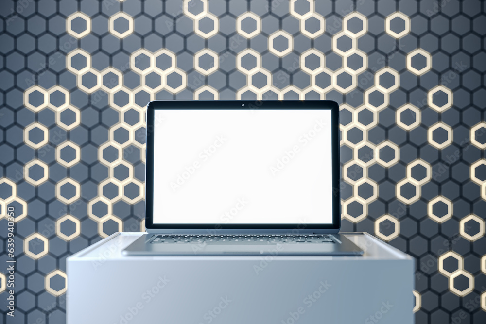 Aufkleber Empty white laptop screen on pedestal with mock up place and gray hexagonal background. Creative presentation concept. 3D Rendering.