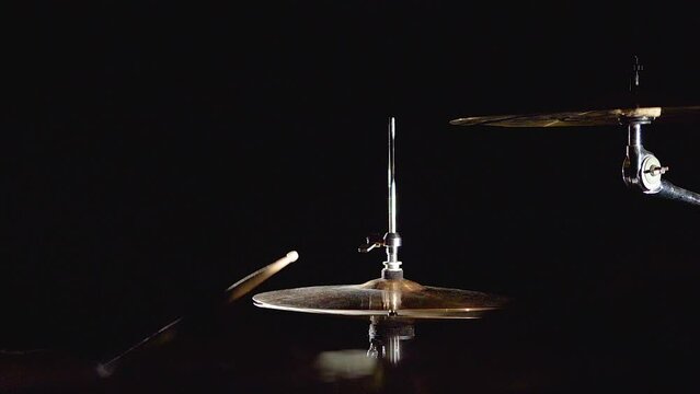 Professional drummer musician man is playing hitting drum kit and cymbals.