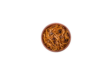 Delicious noodles or udon with mushrooms, salt, spices and herbs