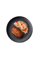Delicious fried cutlets or meatballs of minced fish with rice
