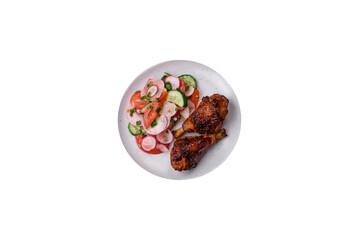 Delicious nutritious dish consisting of grilled chicken legs with a salad