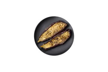 Delicious eggplant cut into two halves baked with salt, spices and herbs