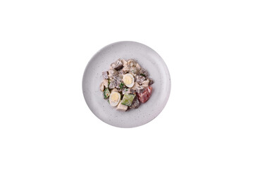 Delicious salad with boiled beef tongue, quail eggs, tomatoes and cucumber