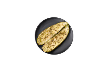 Delicious zucchini cut into two halves baked with salt, spices and herbs