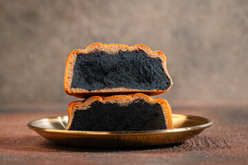 A mooncake  is a Chinese bakery product traditionally eaten during the Mid-Autumn Festival.