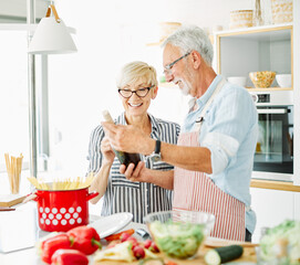love kitchen senior woman man couple wine glass bottle drink tasting retirement food husband wife together