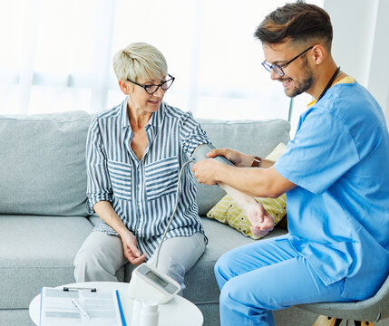 nurse doctor senior care caregiver help check exam blood pressure check pulse retirement home stethoscope nursing elderly man woman health