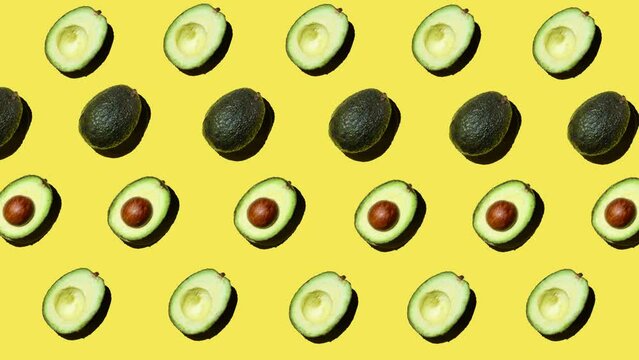 flat lay motion graphics of avocado on yellow background