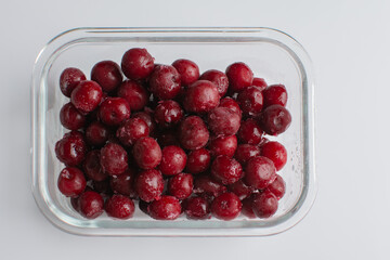 cherry in a glass bowl on the white background, frozen cherry