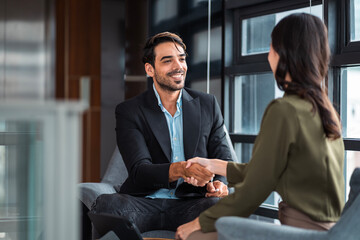 Male mature caucasian ceo businessman leader with diverse coworkers team executive managers group meeting. Multicultural professional businesspeople working together on research plan boardroom.