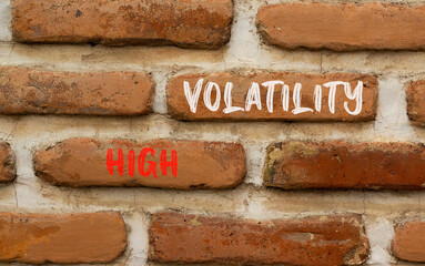 High volatility symbol. Concept words High volatility on beautiful brick wall. Beautiful red brown...
