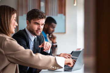 Male mature caucasian ceo businessman leader with diverse coworkers team executive managers group meeting. Multicultural professional businesspeople working together on research plan boardroom.