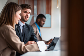 Male mature caucasian ceo businessman leader with diverse coworkers team executive managers group meeting. Multicultural professional businesspeople working together on research plan boardroom.