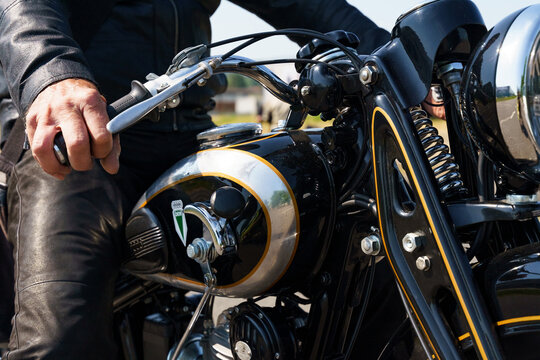 A dkw nz 350 motorcycle parked in front of a Burgenland classic.