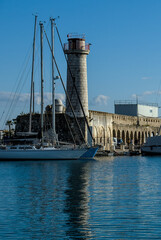 Boat floating near tower in harbour of Antibes, France
