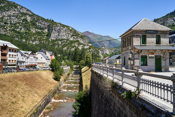 Fototapeta na wymiar Old station of canfranc with the Aragon river passing next to it.