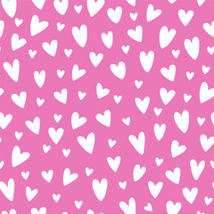 Hand drawn doodle hearts on a background seamless pattern. Valentine`s day theme.Vector illustration.