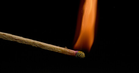 Igniting Match against Black background