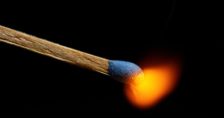 Igniting Match against Black background