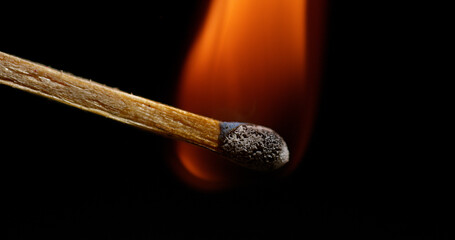 Igniting Match against Black background