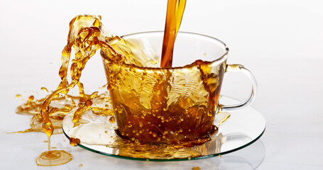 Coffee Being Poured in a Cup against White Background