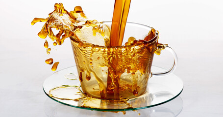 Coffee Being Poured in a Cup against White Background