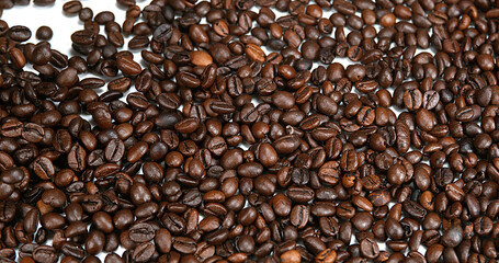 Coffee Beans Falling against White Background