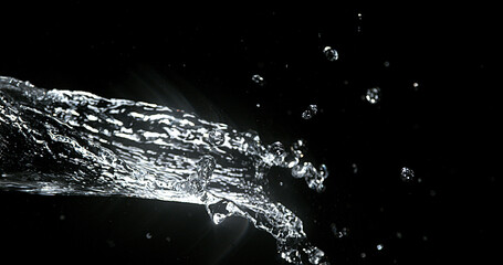 Water spurting out against Black Background