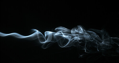 Smoke of Cigarette rising against Black Background