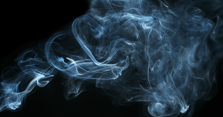 Smoke of Cigarette rising against Black Background