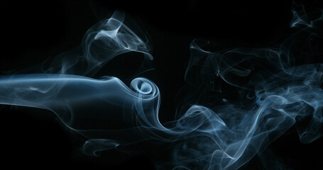 Smoke of Cigarette rising against Black Background