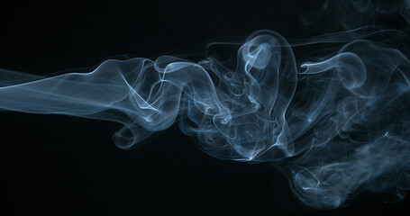 Smoke of Cigarette rising against Black Background