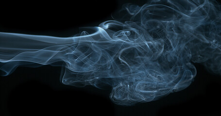 Smoke of Cigarette rising against Black Background