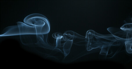 Smoke of Cigarette rising against Black Background