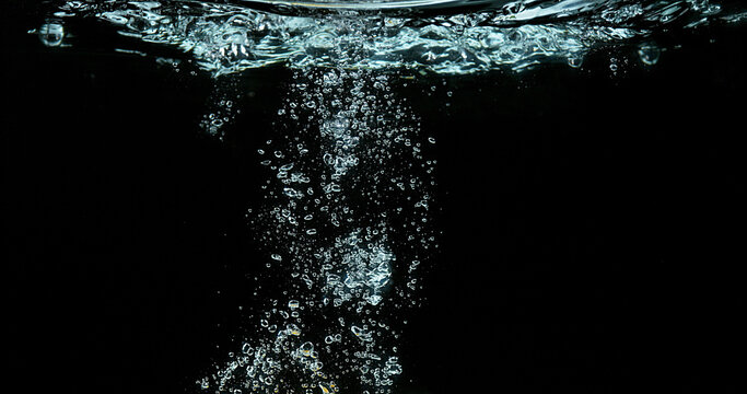 Bubbles of Air in the Water on Black Background