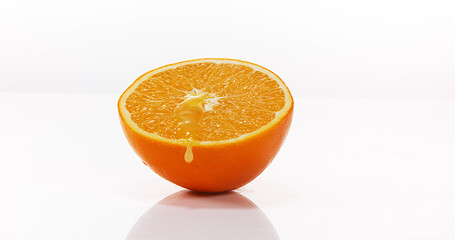 Orange, citrus sinensis, Fruit Flowing against White background