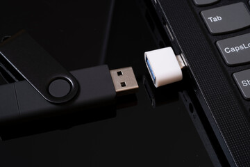 flashcard and laptop. data transmission. solid state drive.