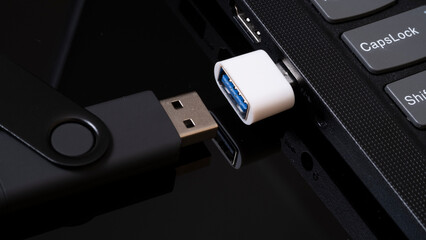 flashcard and laptop. data transmission. solid state drive.