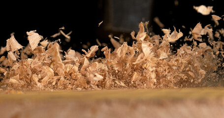 Wood Chips Falling on a Board