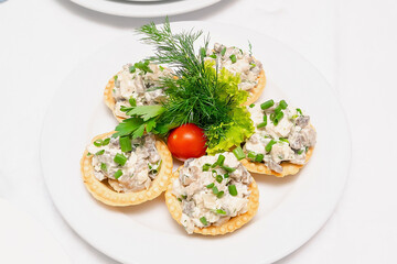 Tartlets bruschetta sandwich with mushroom,chicken, tomatoes,greenery on plate. Tasty healthy food,Italian cuisine appetizer. top view flat lay