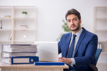 Young male employee working in the office