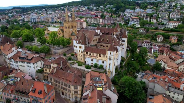 Switzerland travel and scenic places. Aerial drone view of Neuchatel charming town and impressive medieval castle overlooking the lake