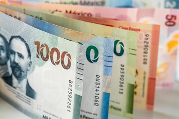 Mexico money, mexican pesos, stacked various banknotes, 1000 pesos banknote, financial business concept, close up - 639993104