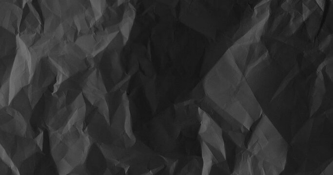 Black crumpled paper texture. Stop Motion. Seamless Looped. Grunge Paper Texture Noise Animated Stop Motion Background and Overlays.