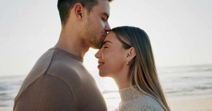 Eskimo kiss, couple and travel, happiness at the beach and love with bonding, romantic date outdoor and forehead touch. Adventure, man and woman in healthy relationship, sunshine and ocean with peace