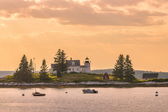 Pumpkin Island lighthouse in Stonington, Maine at sunset