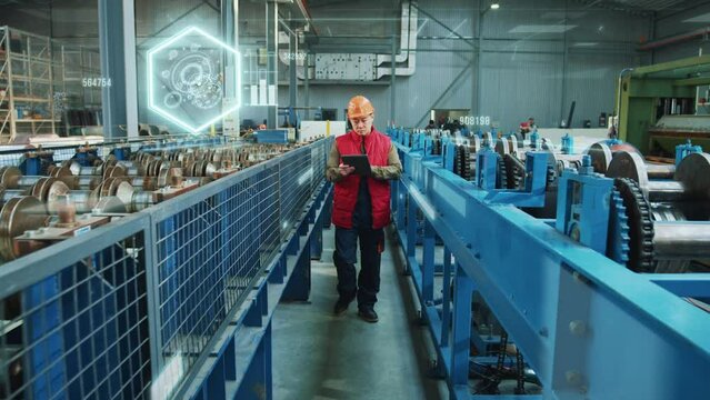 Professional engineer walking at factory. Augmented processing. Digitized image of future work at ennterprises. Checking status of manufacture