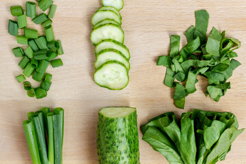 Sliced green vegetables on a cutting board. Top view.