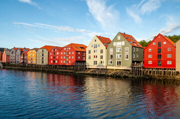Fjord embankment with colorful wooden houses in Trondheim city, Norway.